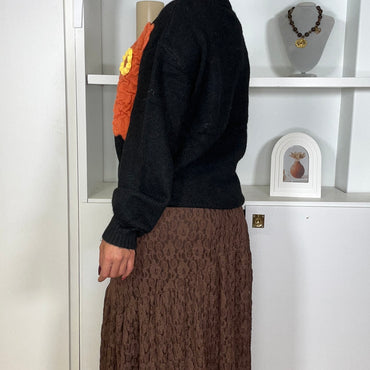 Camisola malha com flor em Preto