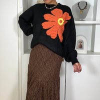 Camisola malha com flor em Preto