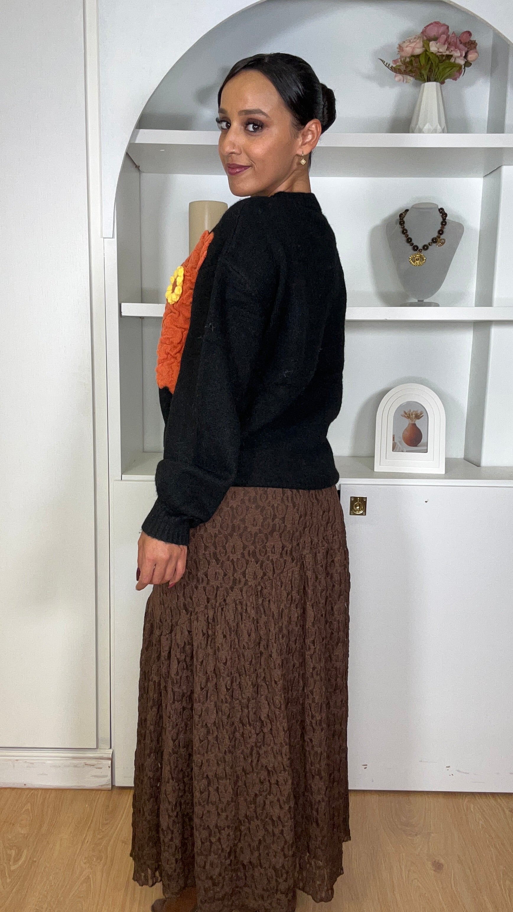 Camisola malha com flor em Preto