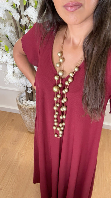 Vestido oversize com folho na manga em Bordo