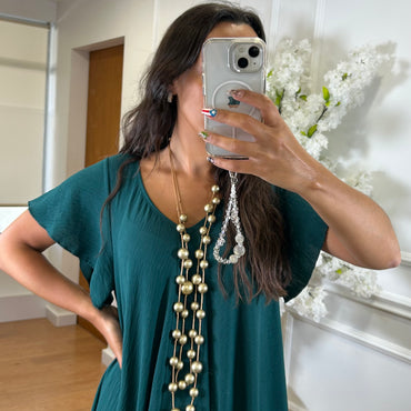 Vestido oversize com folho na manga em Verde Esmeralda